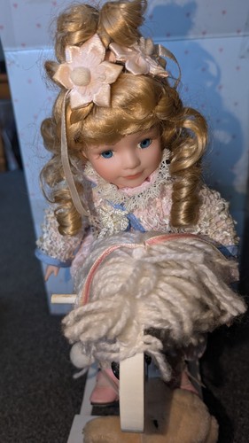 Porcelain doll rocking - on,