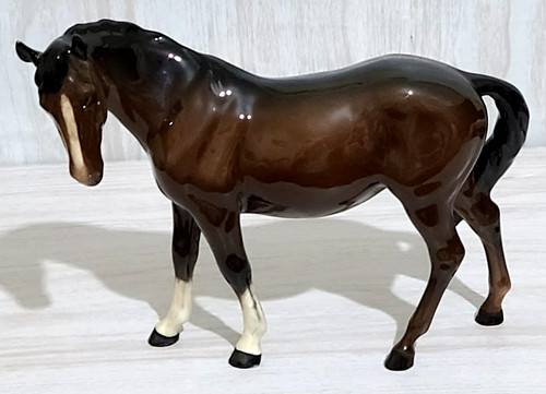 Beswick mare facing left - left, bay