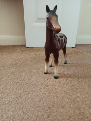 Porcelain bay horse figurine