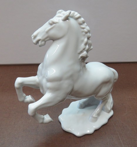 White porcelain figurine a - figurine,